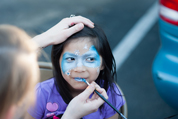 child having her face painted