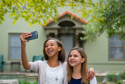 two girls taking a photo